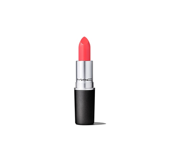 Image of MAC Cosmetics Vegas Volt lipstick - a medium bright coral shade. The lipsticks open showing the lipstick colour.