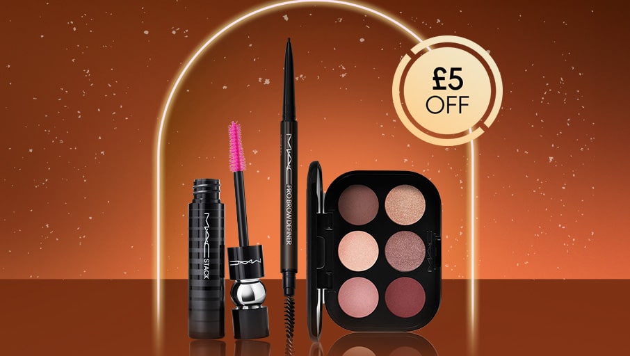 mac eye makeup products on a orange background