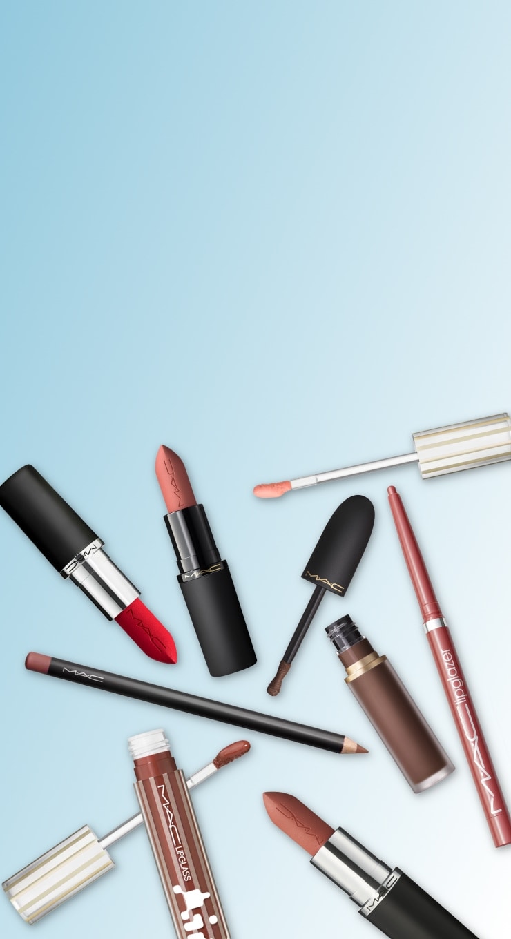 red makeup bag and products on blue background