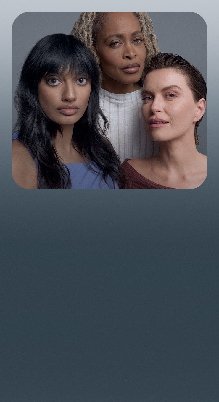 Three models on a blue background wearing MAC Studio Fix Foundation