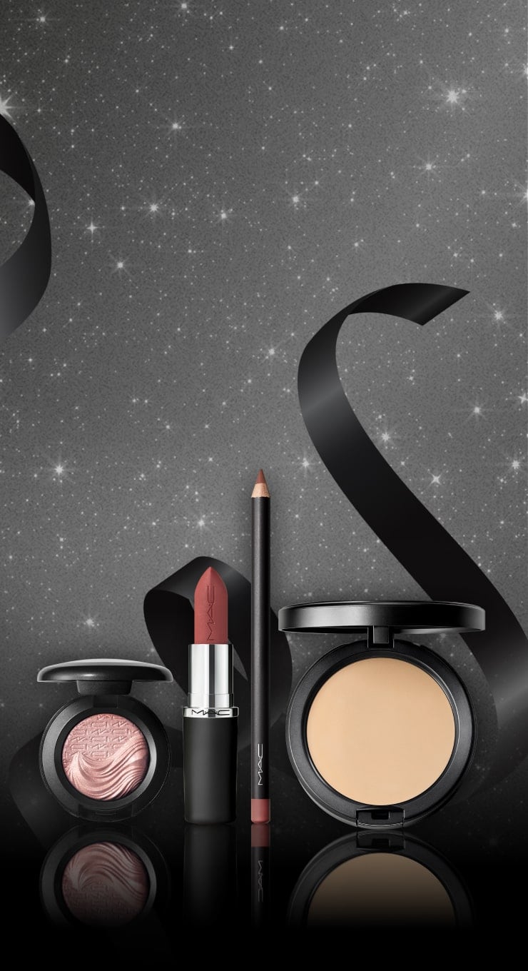 eyeshadow, lipstick, lipliner and powder on black background